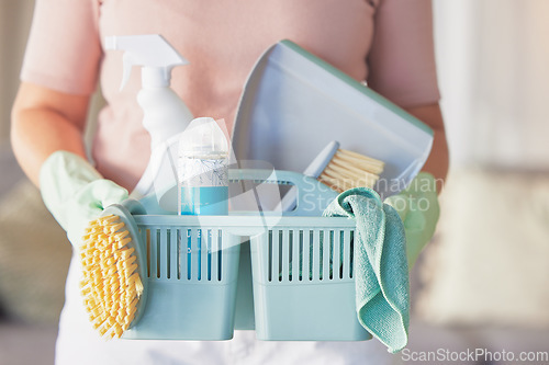 Image of Woman, hands and cleaning equipment in housekeeping for disinfection or dirt removal at home. Hand of female cleaner holding basket of clean supplies or detergent for disinfect, hygiene or services