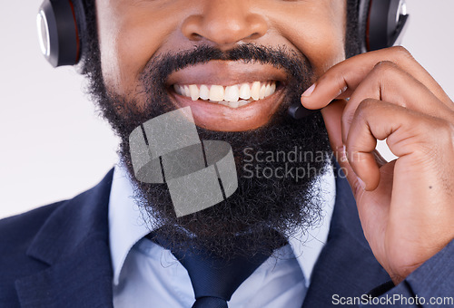 Image of Call center, happy black man and face with microphone for crm questions, sales consulting and studio. Mouth, smile and male telemarketing consultant for contact, telecom and friendly customer support