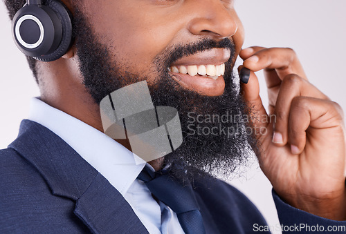 Image of Call center, face and happy black man with microphone for crm questions, sales consulting and studio. Mouth, smile and male telemarketing consultant for contact, telecom and friendly customer support