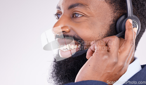 Image of Call center, smile and face of black man with microphone for crm questions, sales consulting and help. Happy male telemarketing consultant in studio for contact, telecom and friendly customer support