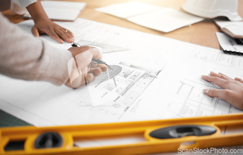 Image of Hands, collaboration and planning with an architecture team working in their office on design from above. Teamwork, construction or blueprint with an architect, designer and engineer at work together