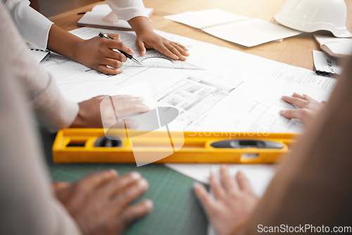 Image of Hands, collaboration and design with a architecture team working in their office for planning from above. Teamwork, construction or blueprint with an architect, designer and engineer at work together