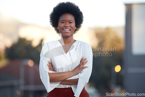 Image of Business black woman, arms crossed and portrait in street, city and smile for confidence, mindset or mission. African entrepreneur, manager or businesswoman with happiness outdoor for company success