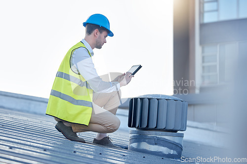 Image of Engineering, digital tablet and engineer on a rooftop to inspect, fix or do maintenance on an outdoor fan. Technology, research and male industrial worker working with a mobile device on a building.