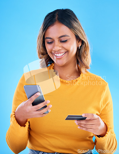 Image of Happy woman, credit card and phone in studio for online shopping, digital fintech payment and customer money. Female model, ecommerce and mobile banking for finance, cash economy and sales promotion