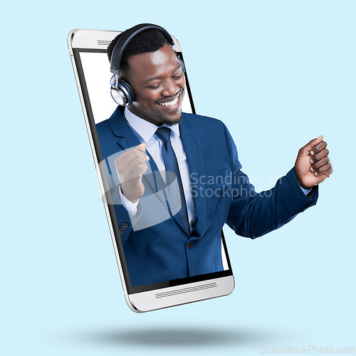 Image of Phone, headphones and businessman in studio for a music app or website on the internet. 3d display, radio and African male model dancing to a song, album or playlist in cellphone by blue background.