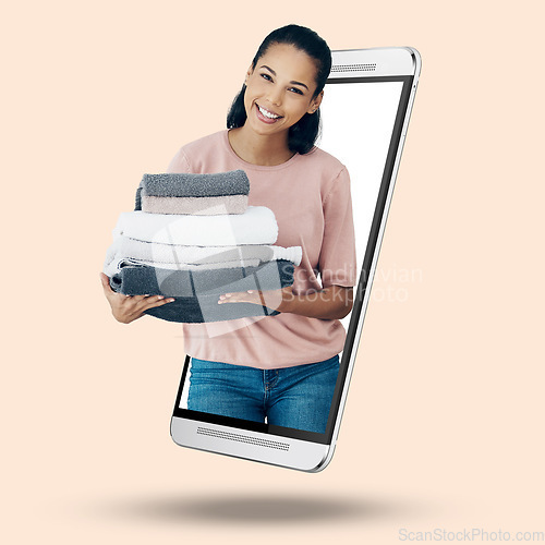 Image of Woman, phone and screen on mockup for housekeeping, advertising or marketing against a studio background. Portrait of female cleaner with laundry towels on mobile smartphone display for advertisement