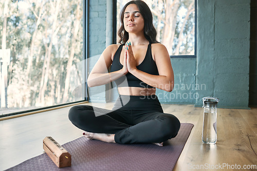 Image of Yoga meditation, prayer hands and woman in gym for health, wellness and exercise. Pilates, zen chakra and calm female yogi meditate with namaste for holistic training, peace and mindfulness workout.
