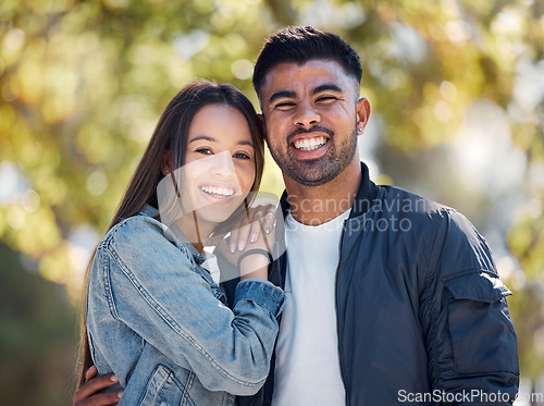 Image of Couple, outdoor and portrait with a smile for love, care and happiness together in summer. Young man and woman at nature park for affection or hug on a happy and romantic date or vacation to relax