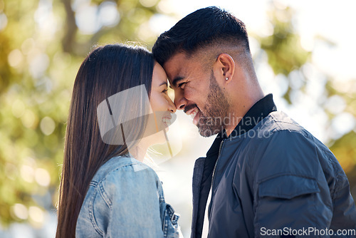 Image of Couple, outdoor and smile on face for love, care and happiness together in summer. Head of young man and woman at nature park for affection or hug on a happy and romantic date or vacation to relax