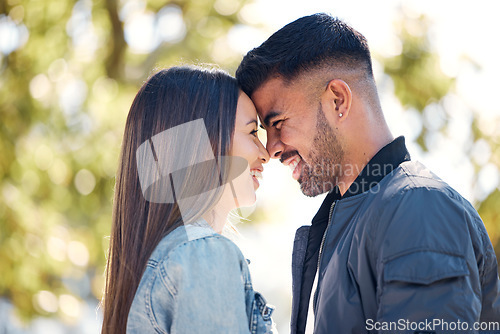 Image of Happy couple, outdoor and smile for love, care and happiness together in summer. Head of young man and woman at nature park for affection or laughing on a romantic date, holiday or vacation to relax