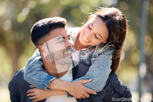 Image of Couple, outdoor and piggy back with a smile for love, care and happiness together in summer. Young man and woman at nature park for affection or hug on a happy and romantic date or vacation to relax