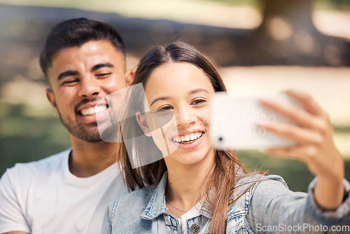 Image of Outdoor, couple and smile with a selfie for love, care and happiness together in summer. Young man and woman at nature park for a profile picture on a happy and romantic date or vacation to relax