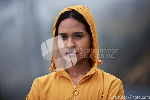 Image of Serious, winter and woman in nature for fitness, running and thinking of motivation for training. Sports, idea and a female runner in the cold for exercise, cardio and looking at a path to train