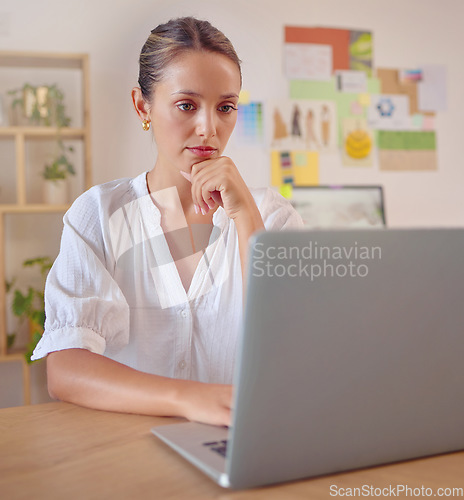 Image of Laptop focus, thinking and business woman, fashion designer or stylist review design, illustration or digital sketch. Office reading, creativity and serious person contemplating creative trend idea