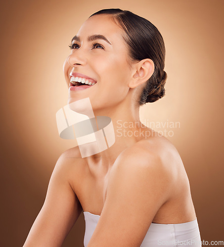 Image of Studio face, laugh and beauty woman with luxury facial cosmetics, natural makeup and skincare glow. Dermatology healthcare satisfaction, spa salon person or aesthetic female model on brown background