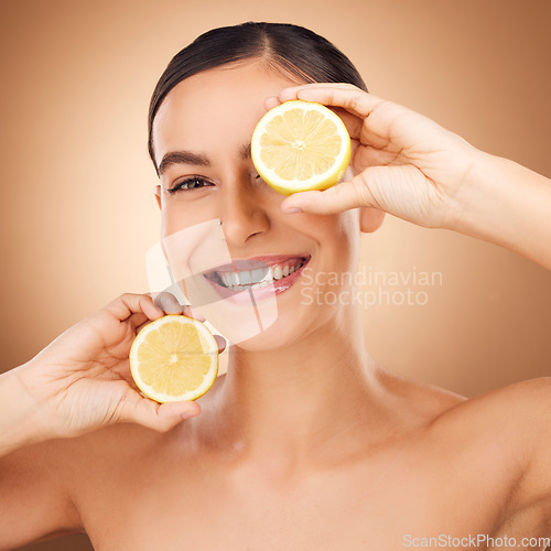 Image of Lemon skincare, portrait and woman face cleaning of a young person with happiness in a studio. Happy, smile and dermatology treatment of a female with cosmetics, spa and cosmetology luxury facial