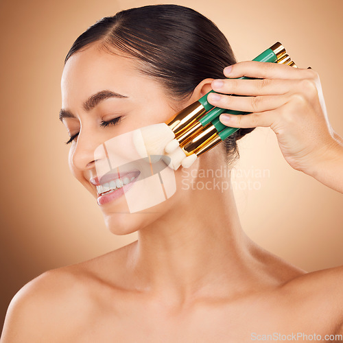 Image of Skincare, makeup brush and woman face cosmetic of a young person with happiness in a studio. Happy smile and dermatology treatment of a female with cosmetics, spa and cosmetology luxury facial