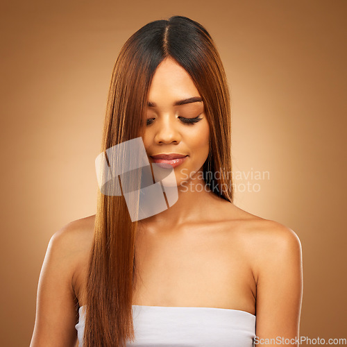 Image of Hair care, straight and beauty of woman in studio for growth and color shine or healthy texture. Aesthetic female face for natural makeup cosmetics, hairdresser or salon mockup on a brown background