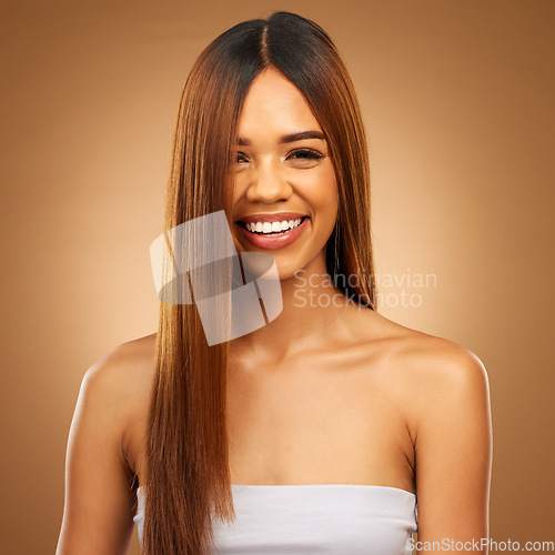 Image of Haircare, beauty and smile portrait of woman in studio for growth and shine or healthy texture. Aesthetic female happy face for hair, natural self care and hairdresser or salon on brown background