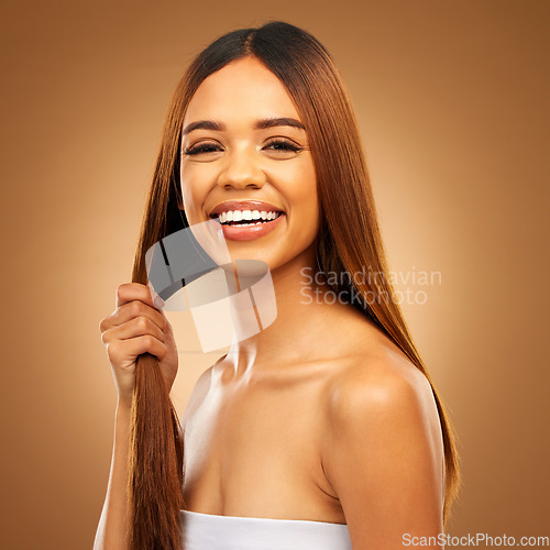 Image of Haircare, hair in hand and portrait of woman in studio with natural texture and luxury salon shine. Happy beauty model, mockup and smile, straight hairstyle with keratin product on brown background.