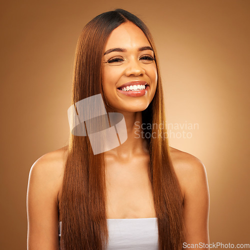 Image of Hair, beauty and smile portrait of woman in studio for growth and color shine or healthy texture. Aesthetic female happy for haircare, natural makeup and hairdresser or salon on a brown background