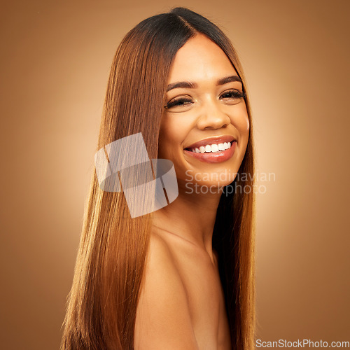 Image of Hair care, beauty and smile of woman portrait in studio for growth and color shine or healthy texture. Aesthetic female happy for haircare, natural makeup and hairdresser or salon brown background