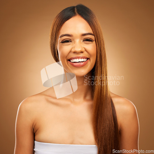 Image of Smile, beauty and hair care portrait of woman in studio for growth, color shine or healthy texture. Happy female face for haircare, natural makeup and hairdresser or salon on brown background