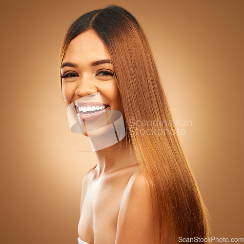 Image of Portrait, beauty and hair care of woman in studio for growth and color shine or healthy texture. Aesthetic female happy face for haircare, natural makeup and hairdresser or salon on brown background