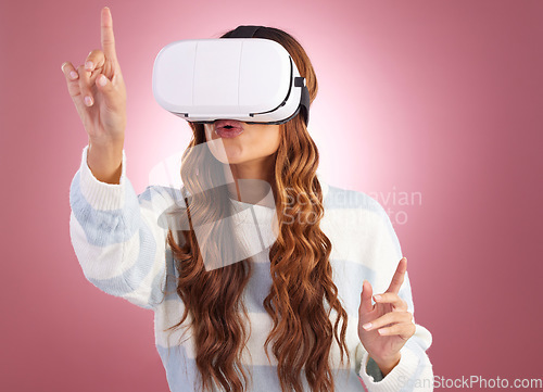 Image of Virtual reality, metaverse and AI with a woman a headset to access the online world of gaming. Innovation, 3D or VR and a female gamer in studio on a pink background with future technology