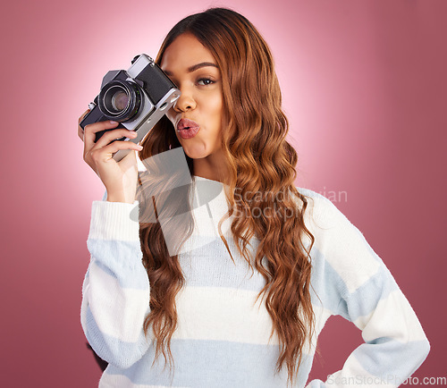 Image of Portrait, photography and happy woman in studio with camera, pose and gen z retro aesthetic on pink background. Face, photographer and girl posing for picture, photo or photograph on isolated mockup