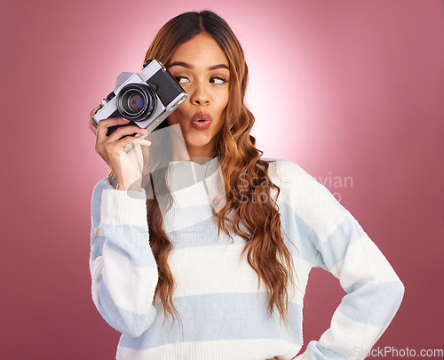 Image of Camera, woman and happy photographer in studio for fun, posing and gen z retro aesthetic on pink background. Lens, photographer and girl posing for picture, photo or photograph on isolated mockup