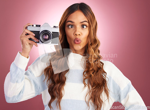 Image of Photography, woman with camera and comic face on studio background, creative travel or fashion shoot. Art, professional lifestyle and hispanic photographer with hobby or career in photos or pictures.