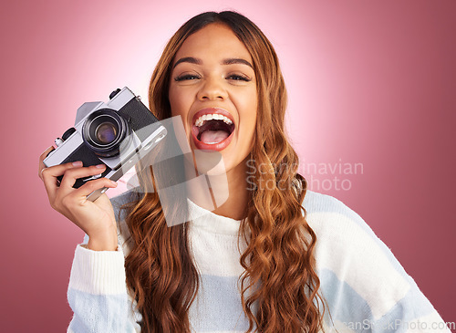 Image of Photography, portrait of woman with camera and smile on studio background in creative travel or fashion shoot. Art, professional and happy hispanic photographer, hobby or career in photos or pictures