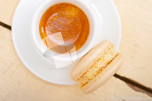 Image of colorful macaroons with espresso coffee