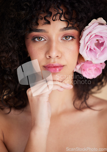 Image of Makeup, flowers and portrait of woman with beauty, cosmetics and hair care for wellness, glamour and glow. Salon aesthetic, spa and girl for natural face, skincare and facial treatment in studio