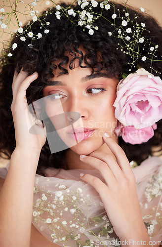 Image of Flowers, beauty and face of woman with cosmetics, makeup and hair care for wellness, glamour and glow. Spring aesthetic, spa and girl with fabric for natural, skincare and facial treatment in studio