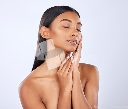 Image of Eyes closed, hair care or Indian woman in studio for healthy natural shine, keratin growth or wellness. Salon skincare, relax or beautiful glowing young girl model with self love on white background