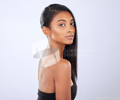 Image of Indian woman, hair care or mockup in studio portrait for strong, healthy natural shine or wellness. Face of glowing young girl model, beauty spa or self care cosmetics in grooming on white background