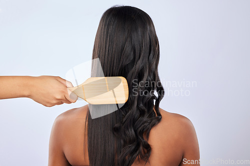 Image of Back, woman or hair care brush in studio for beauty, self love or style treatment on white background. Hand, relaxing or young girl model with salon equipment in grooming routine on mockup space