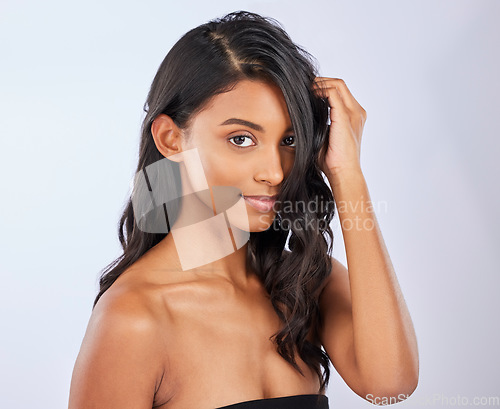 Image of Model, hair care or woman in studio portrait for healthy natural shine, beauty or wellness on white background. Face of glowing young Indian girl or salon spa self care cosmetics for grooming results