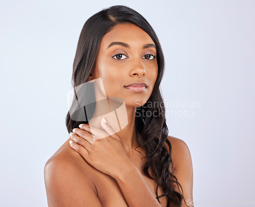 Image of Indian girl, hair or beauty in studio portrait for growth, healthy natural shine or grooming wellness. Face of glowing young woman model, salon spa mockup or self care cosmetics on white background