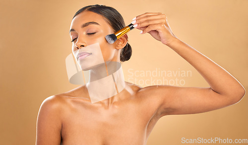 Image of Indian woman, face and makeup brush and beauty with cosmetic tools and eyes closed on studio background. Skin glow, cosmetology and apply foundation or powder, cosmetics and peace with self care