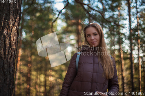 Image of Pretty happy woman in forest