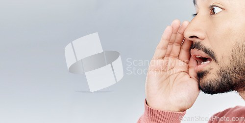 Image of Whisper, secret and man in studio with gossip, sneaky and gesture on mockup against grey background. Hush, news and asian male sharing confidential, drama or mystery while posing with symbol isolated