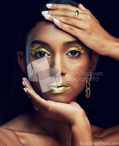 Image of Indian woman, art makeup and studio portrait for beauty, wellness or celebration by black background. Model face, asian girl and dark aesthetic with gold lipstick, jewellery or cosmetic for a queen