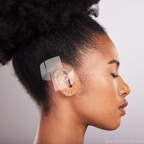 Image of Skincare, beauty and profile of black woman with confidence, white background and cosmetics product. Health, dermatology and natural makeup, African model in studio for healthy skin care and wellness