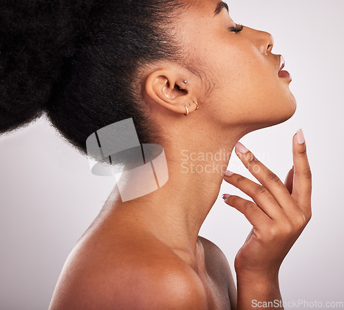 Image of Skincare, cosmetics and profile of black woman with confidence, white background and beauty product. Health, dermatology and natural makeup, African model in studio for healthy skin care and wellness