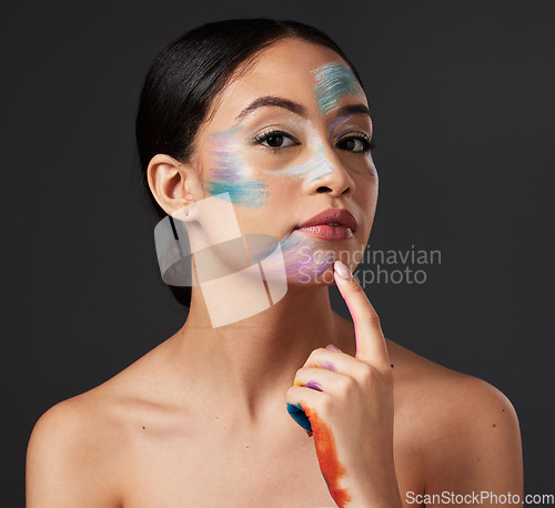 Image of Skin, art and portrait of woman with face paint, creative makeup and self expression. Beauty, creativity and color in artistic cosmetics, empowerment and freedom to express for young beautiful girl.