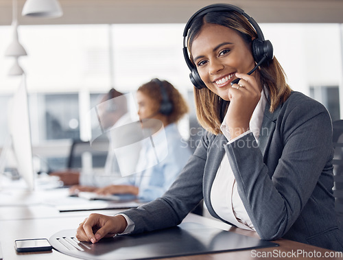 Image of Call center woman, portrait and smile in office for customer support job, happiness or microphone at desk. Indian telemarketing consultant, desktop pc or happy crm with communication in workplace